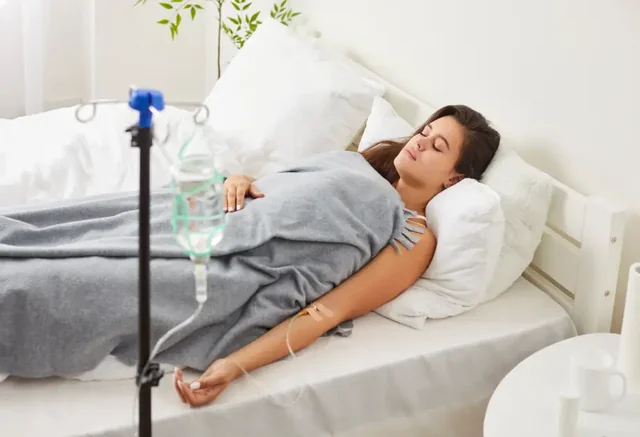 A patient resting during a supervised infusion