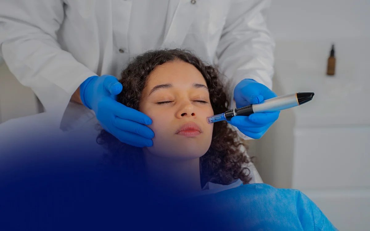 A clinician carrying out a facial skin procedure